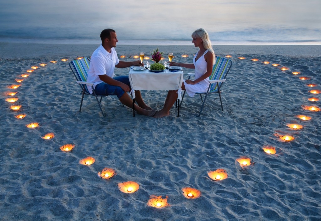 Couple with Heart Candles on Beach