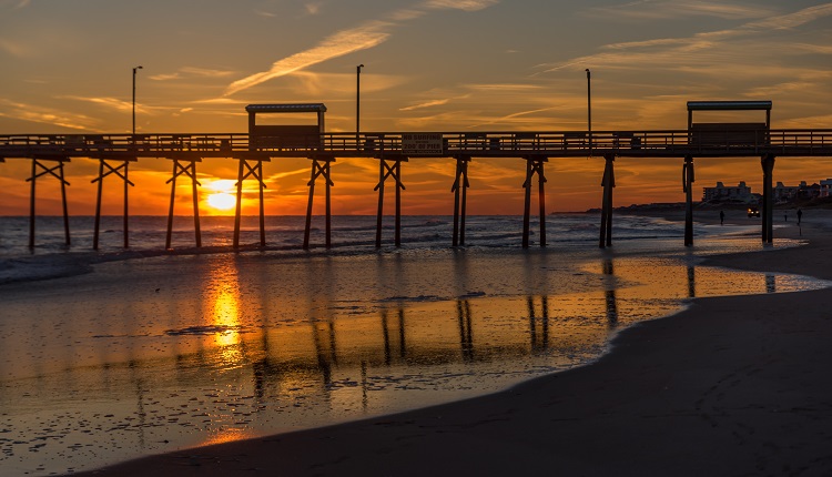 View of sunset behind Bogue Inlet Pier in Emerald Isle