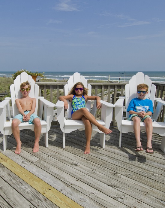 Kids Lounging in Deck Chairs at Oceanfront Vacation Rental in Emerald Isle, NC