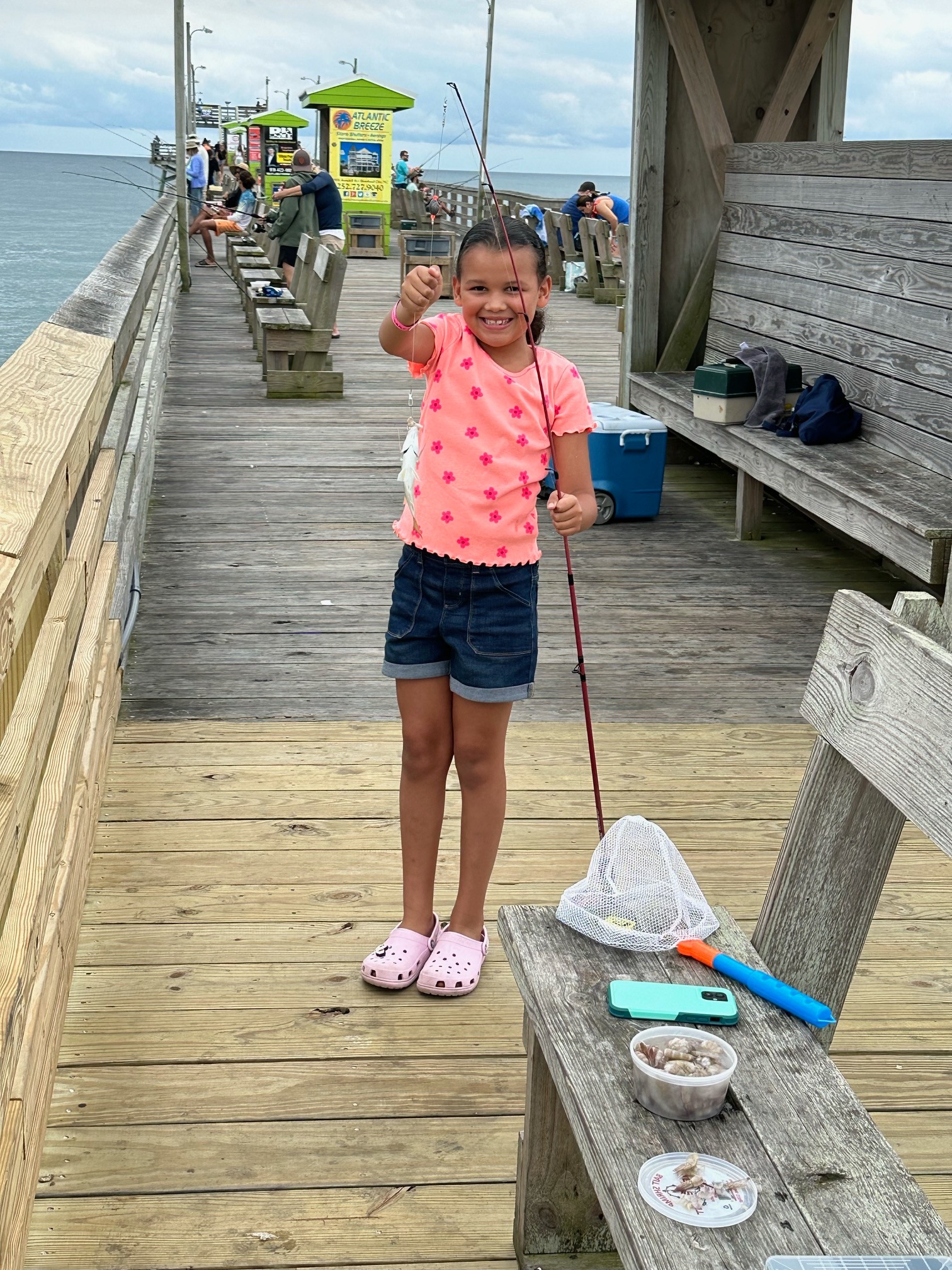 Girl with fish caught at Bogue Inlet Fishing Pier
