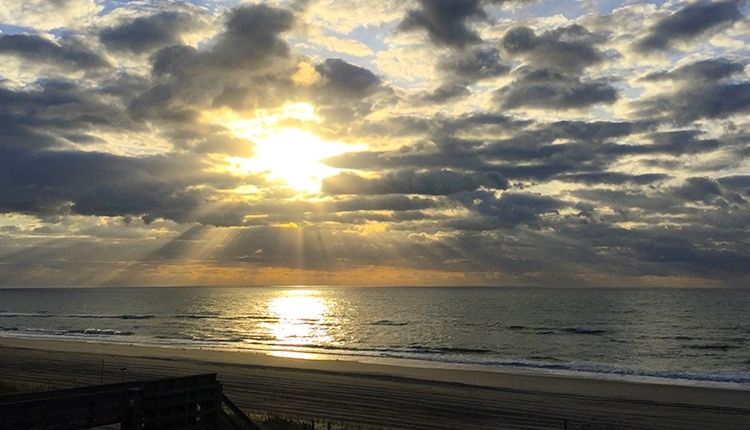 Sunset with clouds on beach