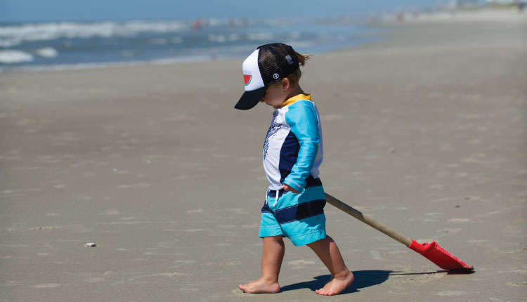 Enjoy family moments on the beach when you book your 2023 vacation with Emerald Isle Realty.