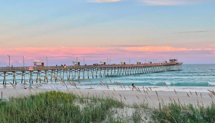 Enjoy stunning sunsets when you book your 2024 vacation with Emerald Isle Realty.