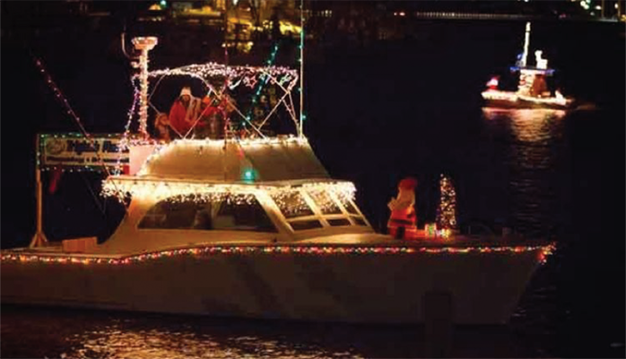 Emerald Isle Santa boat in the parade at night.