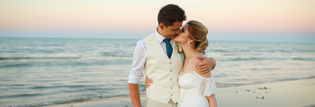 Wedding couple kissing on emerald isle, nc