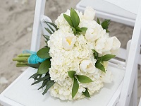 Bouquet on chair at beach